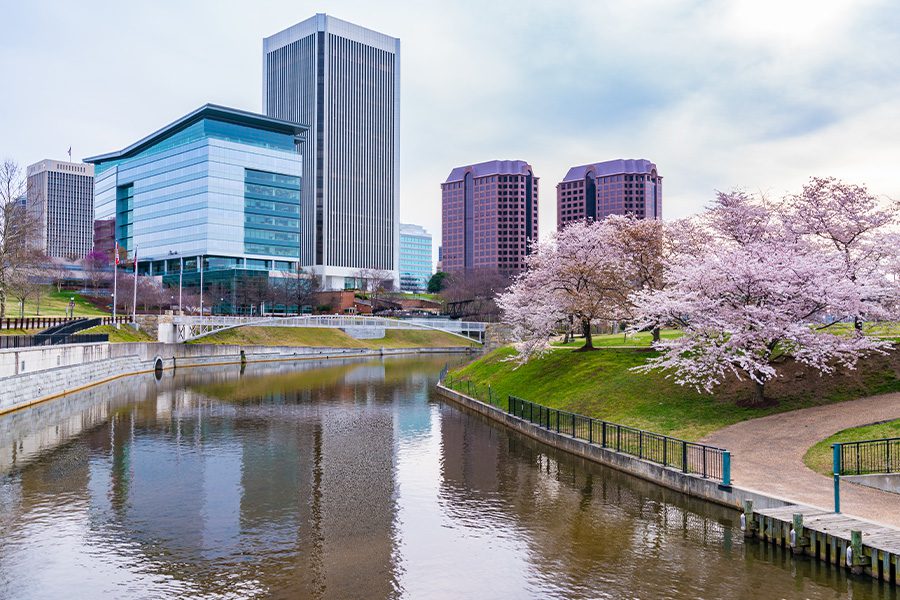 Contact - Close Skyline View of Richmond, Virginia Cherry Blossoms in Bloom on a Sunny Spring Day