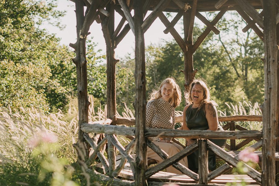Privacy Policy - Portrait Photo of Mary and Emily Sitting Inside a Wooden Pavilion at the Park
